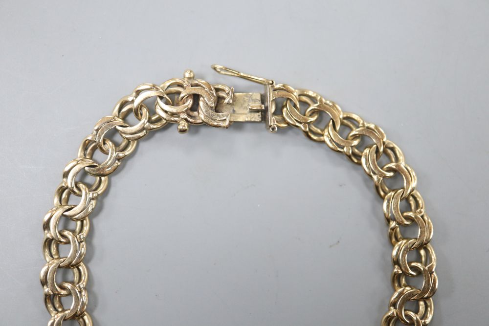 A yellow metal double link bracelet (tests as 9ct gold), 16.5 grams.